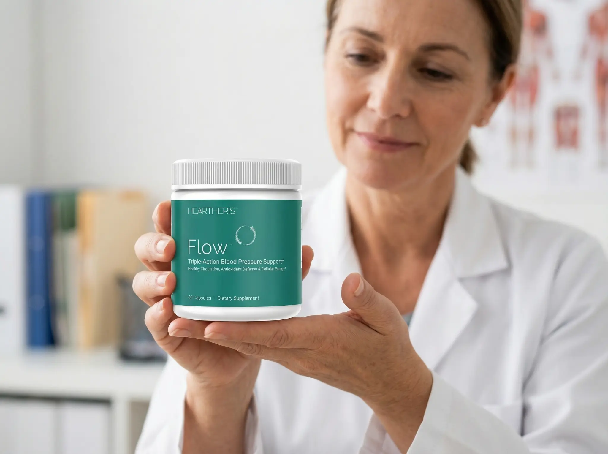 Doctor holding Flow™ supplement bottle